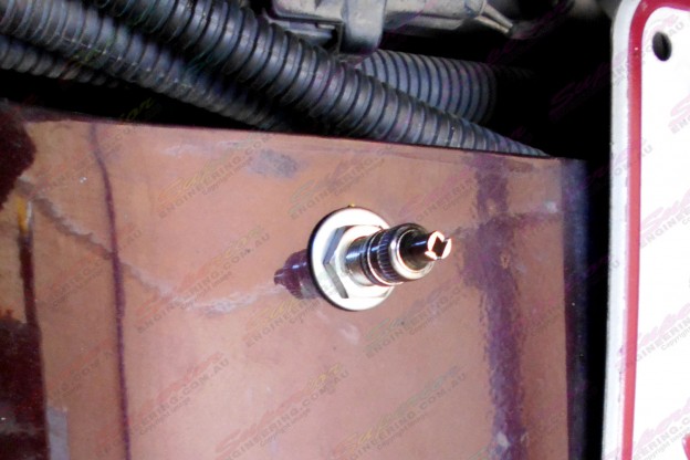 Close-up view of the air hose valve mounted to the rear of the Hilux