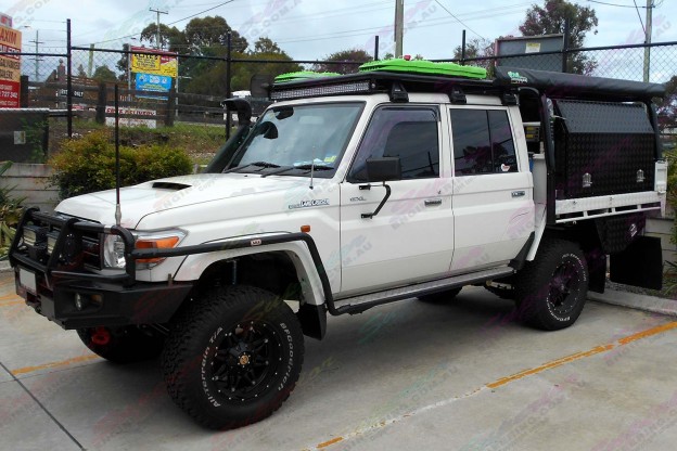 Left side view of a Toyota Landcruiser 79 Series with some AirBag Man Leaf Spring Helpers