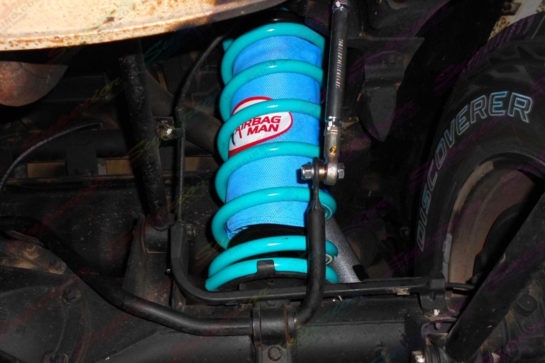 Closeup view of the swaybar extensions and Airbag Man airbag with Superior coil springs